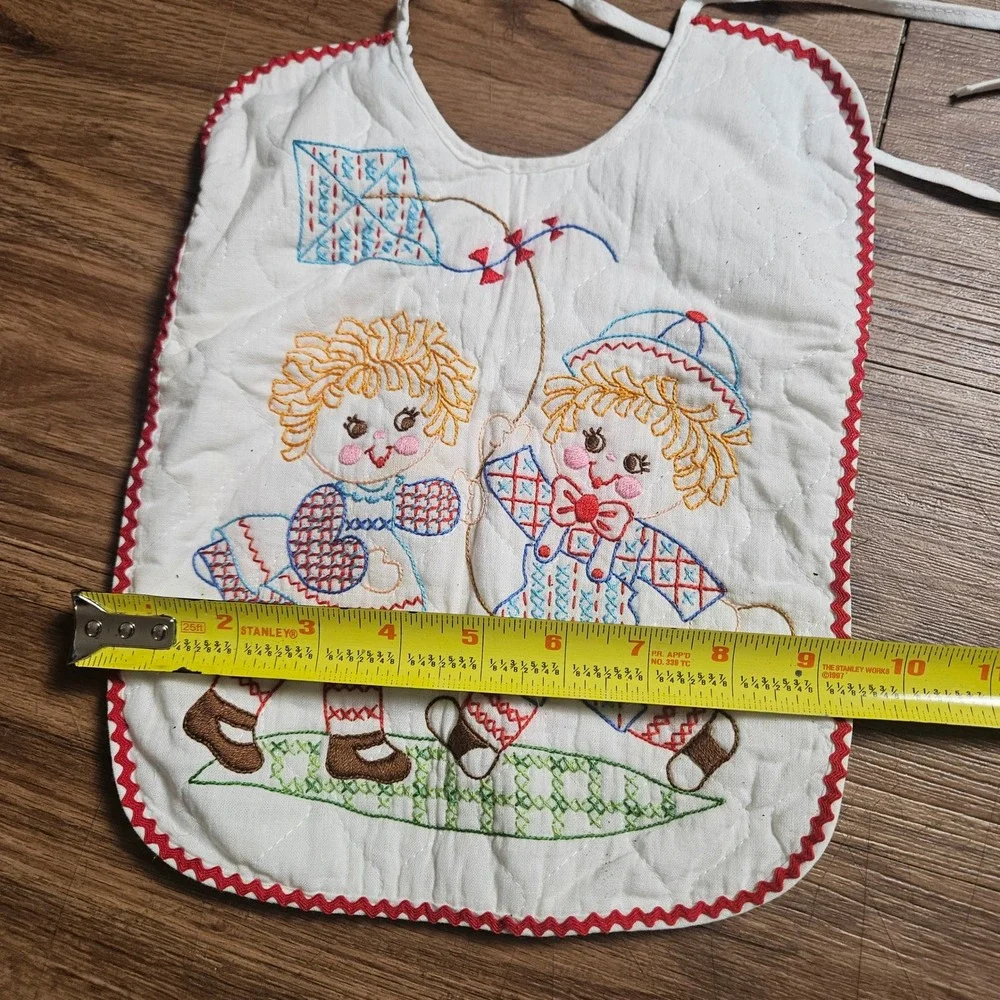 Lot of 2 Vintage Quilted Baby Bibs Embroidered Raggedy Ann Kite Swing Ric Rac